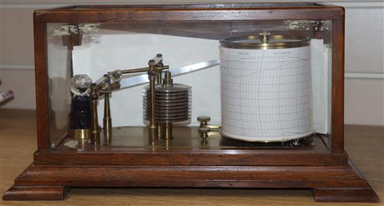 A carved oak barograph